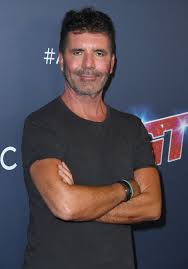 2 of 13 enlarge image cowell wears a blue and white swimsuit on his trip to the tropical island. Simon Cowell S Back Injury Addressed By America S Got Talent