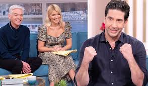 Maybe you would like to learn more about one of these? Phillip Schofield Shows David Schwimmer His Appearence On Friends
