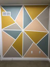 Colour can unknowingly have an impact on our mood and behaviour. Study Room Wall With Geometric Triangles Geometric Wall Paint Geometric Wall Decor Bedroom Wall Paint