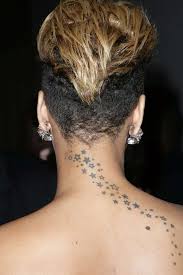 Check out 19 of her most popular tattoos as you can see here, rihanna got a neck tattoo with the text rebelle fleur, again a bang bang creation. Rihanna S Tattoos And What They Mean 2021 Celebrity Ink Guide