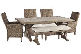 No matter your entertainment style, there's an outdoor dining set to complement every patio, from compact bistro options to large round tables. Beachcroft Outdoor Dining Table And 4 Chairs And Bench Ashley Furniture Homestore