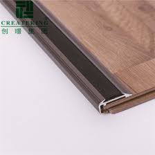Upgrade to one of these for free: China Nails Hidden Aluminium Flexible Flooring Profile Floor Edge Trim Laminate Floor Edging Strip With Soft Rubber Strip China Aluminium Profile Flooring Accessories
