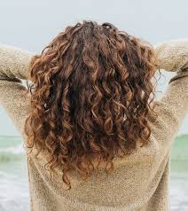 Once you reach the height where you want your curl to start, tie the twist off. How To Get Curly Hair Overnight