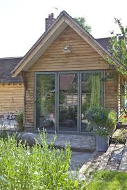 Bi Fold Doors Perfect For A Home Office Good To Keep Moving Parts In Aluminium Even In Timber Bui Garden Room Extensions Summer House Garden House Cladding