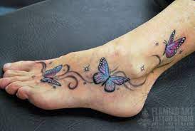 Butterflies On A Foot Tattoo A Photo On Flickriver Foot Tattoos Tattoo Designs Foot Butterfly Foot Tattoo