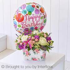 Whether it's a bouquet of heart balloons or a personalised birthday balloon with their photo on, you'll find something to make them smile. Happy Birthday Summer Memories Tin With Happy Birthday Balloon Rosanna S Florist Watford Hertfordshire