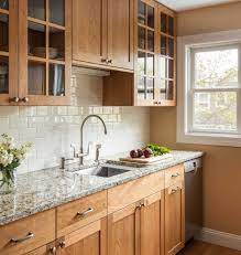 Changing kitchen cabinets from dark to light stain can brighten the space. Natural Cherry Kitchen Farmhouse Kitchen Other By Woodland Cabinetry Houzz