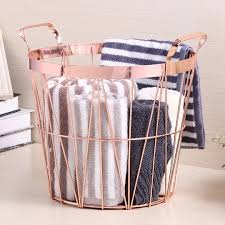 This grid laundry basket from ferm living will go with any color scheme you showcase in your laundry room. Rose Gold Toy Laundry Or Clothes Basket Storage Baskets Wire Basket Storage Wire Storage