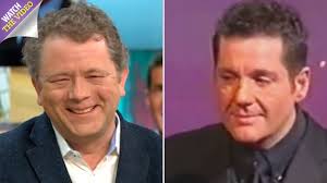 Storm Huntley snapped getting cosy and holding hands with comic Jon Culshaw