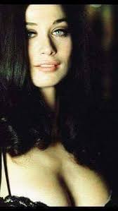 Valerie Leon as the shop assistant Miss Dobbin in Carry