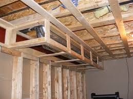Hide Duct Work And Ceiling Wires In Basement With Something A Bit More Inspiring And Invitin Basement Remodeling Low Ceiling Basement Basement Design