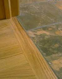 But, there are definitely some circumstances where this type. I Like This One Best As The Wood Does Not Extend Over The Tile It Would Have To Be A Taller Transition Piece Engineered Wood Floors Flooring Wooden Flooring