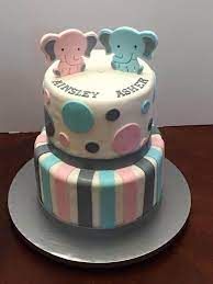 Nikki was having twin baby girls and she wanted everything baby and sugar & spice that we could get onto the cake! Twins Elephant Theme Baby Shower Unique Baby Shower Cakes Twin Baby Shower Cake Baby Shower Cakes Girl