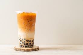 Free Photo Traditional Iced Milk Tea And Red Tea Powder