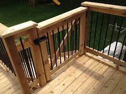 Cedar Gate With Black Aluminum Spindles Www Twincitydeck Com Deck Gate Building A Deck Decks And Porches