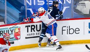 Montreal canadiens forward jake evans was transported to hospital following friday's rookie game against the ottawa senators after he was knocked unconscious during the third period. Lg15dwed Uiq3m