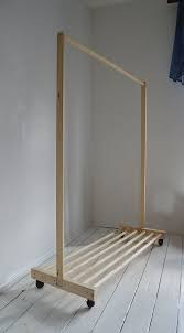 Add 3 coat rack hooks even spaced along the front and about ¾ from the bottom edge. Wooden Clothes Rack Off 55