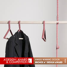 This modern coat rack design made from black walnut wood is both stylish and functional. Oksana Coat Hangers Coat Hanger And Coat Rack