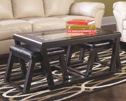 They're often made from durable material and can be stored while on the move. Kelton Coffee Table With Nesting Stools Ashley Furniture Homestore Coffee Table With Stools Coffee Table And Stool Set Coffee Table