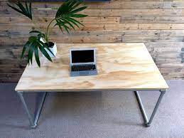 But rather than attempt to hide the layers of the wood, he built it to show off its endgrain in a beautiful herringbone pattern. Diy Plywood Desk With Pipe Frame Plans To Build Your Own Simplified Building