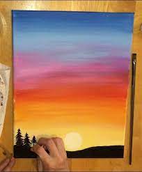 From lovely pink sunset views, and to a blue sky tinged with shades of lovely yellow and orange. Sunset Painting Learn To Paint An Easy Sunset With Acrylics Sunset Canvas Painting Sunset Painting Sunset Painting Easy