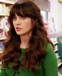 The curly hair looks a little messy at the end because of the ringlets. Zooey Deschanel Zooey Deschanel Hair Zooey Deschanel Hair Brunette Hair Color Hair Styles