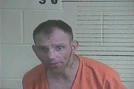 Johnny Mitchell was arrested and charged with Public Intoxication, once at  the jail he was charged with Promoting Contraband1st. He was carrying a  small amount of Meth in his rectum for safe