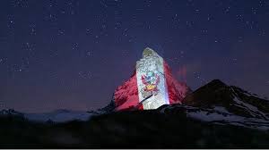 Click on the link above to read the terms for use of this swiss flag on your web page. The Swiss Alps Are Lit Up By The Flag Of Peru Peru Info