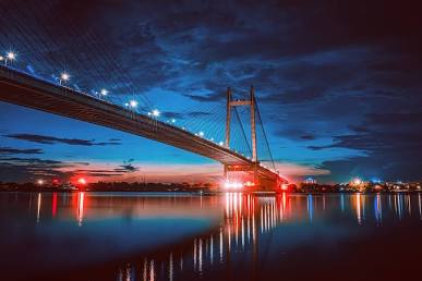 Prinsep Ghat overlooking the illuminated Vidyasagar Setu, AI generated
