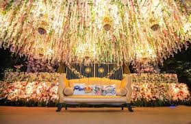 With a fully covered floral backdrop in hues of white and light beige, a ceiling adorning bewitching floral garlands and beaded strings, the dreamy stage setting is remarkable. Stage Decor Ideas For Your 2018 Indian Wedding Indian Fashion Blog