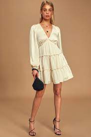 It features a shirred top with scoop neckline, long sleeves with shirred cuffs. Chic Cream Dress Satin Dress Tiered Dress Mini Dress Lulus