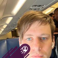 What is the purpose of the small compartment in front of the cup holders in  a 2015 Subaru Crosstrek?