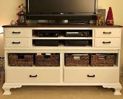 Transformed an outdated hardwood dresser into a functional tv stand with tons of storage! Old Dresser Turned Into Modern Tv Stand Hometalk
