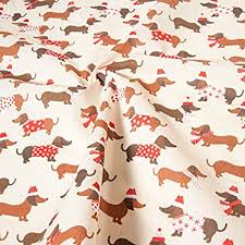 We have been in business close to 30 years. Dogs Fabric Christmas Puppy Dachshund Puppies Polycotton Festive Children S Xmas Metre Amazon Co Uk Kitchen Home