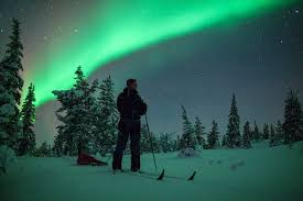 Skiing Under The Northern Lights In Finland Northern Lights Finland Northern Lights Holidays Northern Lights