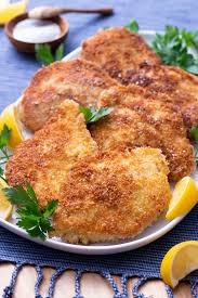 Put the flour in a shallow bowl or dish, whisk the eggs and milk together and put into a separate container, and put the bread crumbs in a third container. Pork Schnitzel Cookthestory