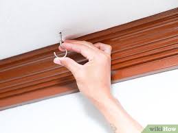 Select a bit that is barely larger than the diameter of the toggle bolt when the wings are folded down. How To Hang A Hook From A Ceiling 9 Steps With Pictures