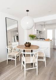 Round Wood Top Dining Table With White Wishbone Chairs Transitional Kitchen