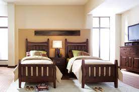 Pretty Table Lamp Between The Wooden Twin Beds On The White Fur Rug Combined With Wooden Flo Twin Bedroom Furniture Sets Bed Furniture Design Twin Bedroom Sets