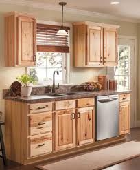 Small Kitchen With Hickory Cabinets A Kitchen With Sturdy Hickory Cabinets Hickory Kitchen Cabinets Kitchen Remodel Small New Kitchen Cabinets