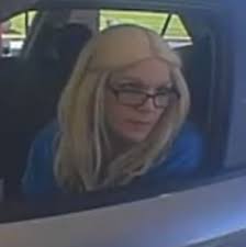 Greenwood Police Department needs your help to identify the person in the  photos below. She is a person of interest in an attempted Fraud case.  Anyone with information is asked to contact