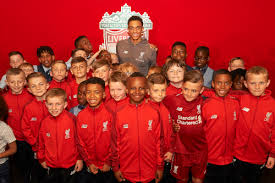 Dressed in a black tracksuit and white trainers, the liverpool. Trent Alexander Arnold Helps Young Reds Sign First Lfc Deals Liverpool Fc