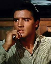 August 4, 1960: Elvis was fitted with contact lenses to change his blue  eyes to brown for his role as Pacer Burton in the film Flaming Star. In the  end, he kept