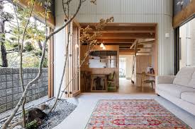 The sand symbolizes the sea, rocks are the islands and the rake is a means for you to traverse rocky waters. Japanese Home On Narrow Lot Embraces Greenery With An Indoor Dry Garden