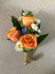 Your love for each other is matched only by your love for the sea. Fishing Lure Pin On Corsage With Orange Spray Roses And White Monte Fishing Themed Wedding Fishing Wedding Wedding Themes Rustic