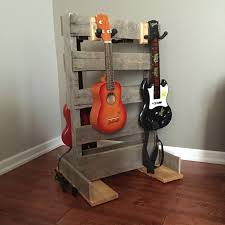 Pallet Guitar Ukulele Stand For Kids Diy Also Works For Guitar Hero Or Rock Band Guitars Guitar Stand Pallet Guitar Stand Ukulele Stand