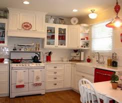 L Shaped Vintage White Kitchen With Red Accents White Farmhouse Kitchens Traditional Kitchen Design Cottage Kitchen Cabinets