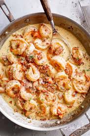 Heat heavy cream and 1 cup butter together in a large saucepan over medium heat until butter is melted. Carbonara Shrimp Alfredo With Bacon Cafe Delites