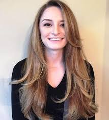 How to cut long hair layered, you can make your face look longer with a medium parting and wavy hairstyle in the shape of a round face. 23 Long Hairstyles To Get A Perfect Look This Season