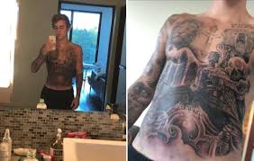 Miley cyrus and justin bieber. Justin Bieber Tattoo Star S Latest Tattoo Covers His Torso Men S Health